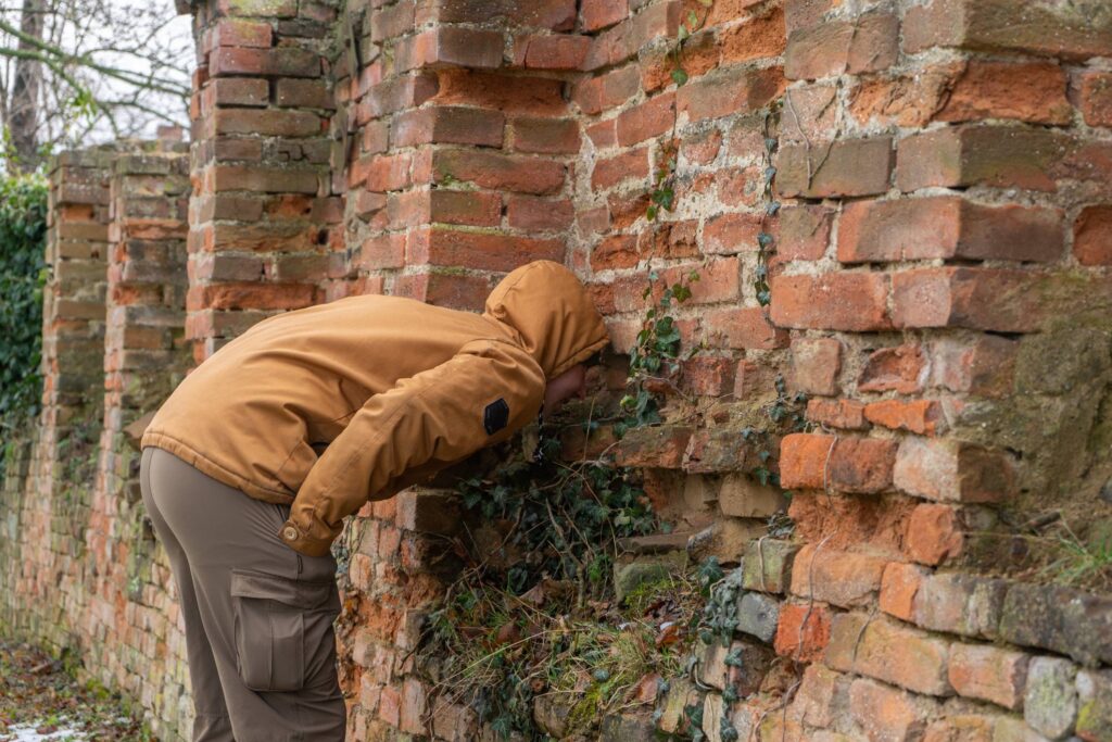 Man interested in the hole.