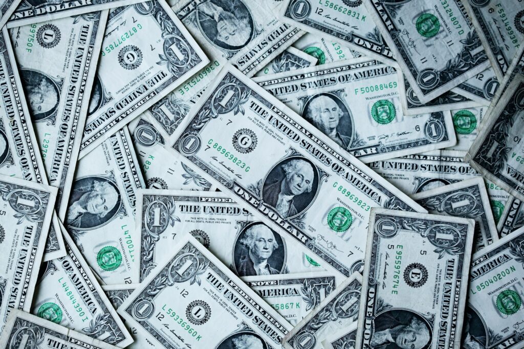Dollars = quality of education, an American way of thinking. Photo by <a href="https://unsplash.com/@sharonmccutcheon?utm_source=unsplash&utm_medium=referral&utm_content=creditCopyText" target="_blank">Alexander Grey</a> on <a href="https://unsplash.com/photos/1-usa-dollar-banknotes-8lnbXtxFGZw?utm_source=unsplash&utm_medium=referral&utm_content=creditCopyText" target="_blank">Unsplash</a>.